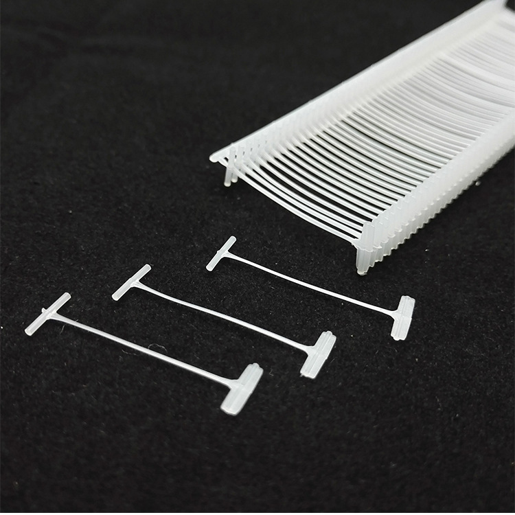 Yiwu suministro blanco y negro transparente aguja de pegamento grueso en forma de I pegamento aguja pistola etiqueta tarjeta hebilla marca cordón 5000 cajas