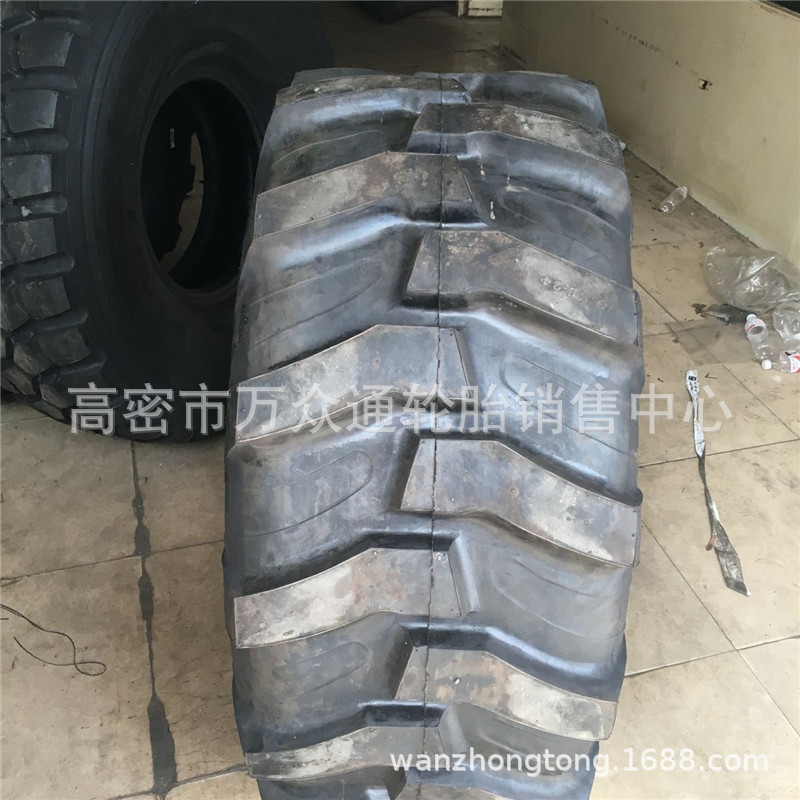 Suministro de neumáticos ocupados de dos cabezas 21L-24 Neumáticos de excavadora retroexcavadora de maquinaria de construcción