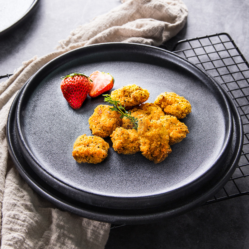 Placa de carne de cerámica esmerilado negro placa de horno redonda placa de sushi esmalte grueso placa de carne a prueba de arañazos hotel de exportación al por mayor