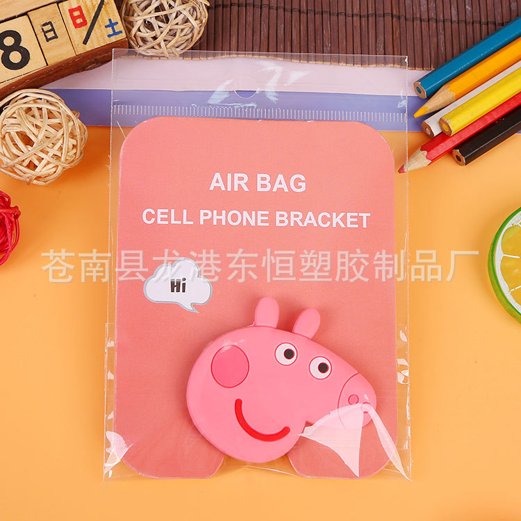 En stock al por mayor TikTok Cartoon creativo soporte de teléfono móvil puede soportar airbag soporte de teléfono móvil soporte de escritorio