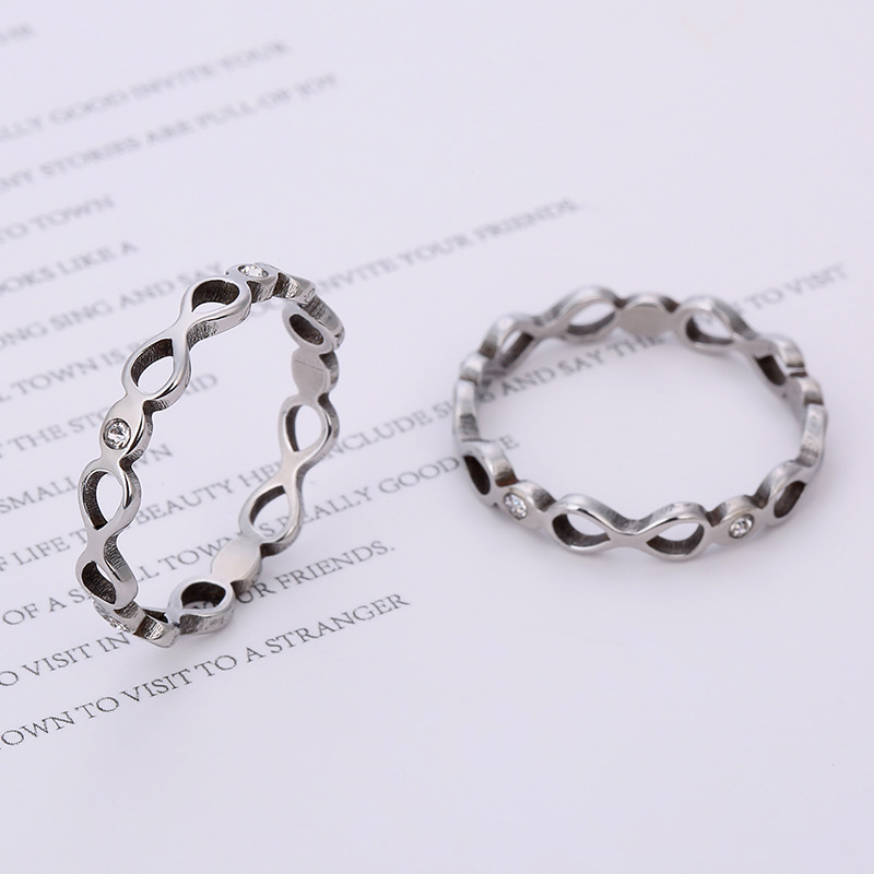 Fabricante de fuente transfronteriza joyería de acero inoxidable corte por láser 8-palabra infinito anillo de acero de titanio de acero inoxidable incrustado en diamante al por mayor