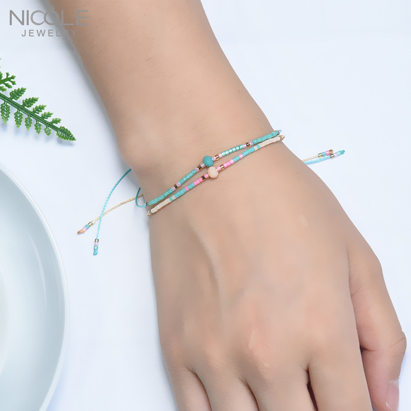 DIY pulsera de la joyería de las mujeres simples granos de arroz personalidad original artesanía color mezclado tejido joyería de moda ventas directas de la fábrica