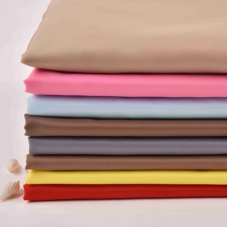 厂家直供包边材料服装工装辅料布料 纯色涤纶染色涤塔夫面料现货