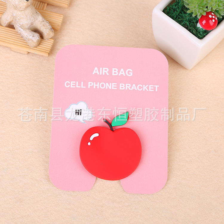 En stock al por mayor TikTok Cartoon creativo soporte de teléfono móvil puede soportar airbag soporte de teléfono móvil soporte de escritorio