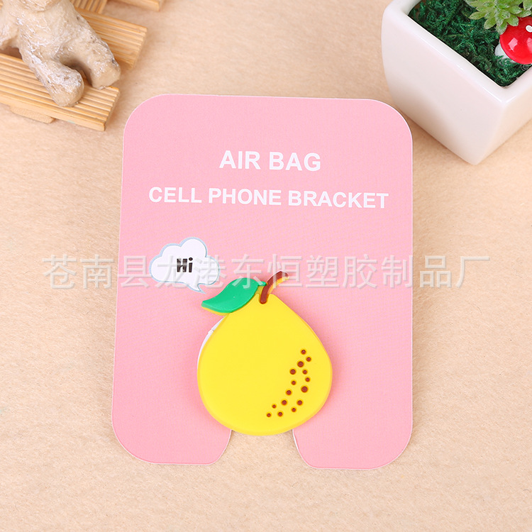 En stock al por mayor TikTok Cartoon creativo soporte de teléfono móvil puede soportar airbag soporte de teléfono móvil soporte de escritorio