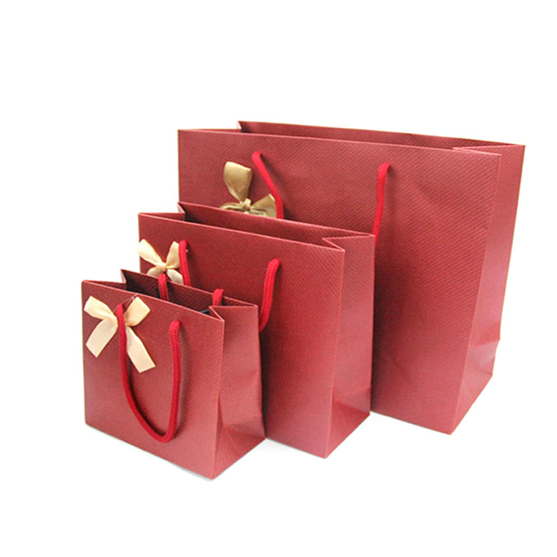 广告手提纸袋特种纸服装购物袋横版通用礼品包装袋批发环保纸袋