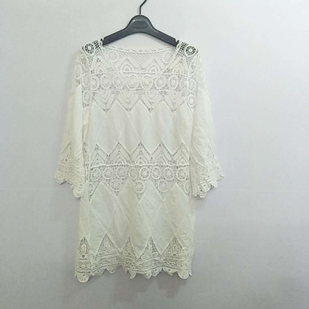 Europa y América nuevo hueco de ganchillo parche bordado playa bikini blusa playa vestido