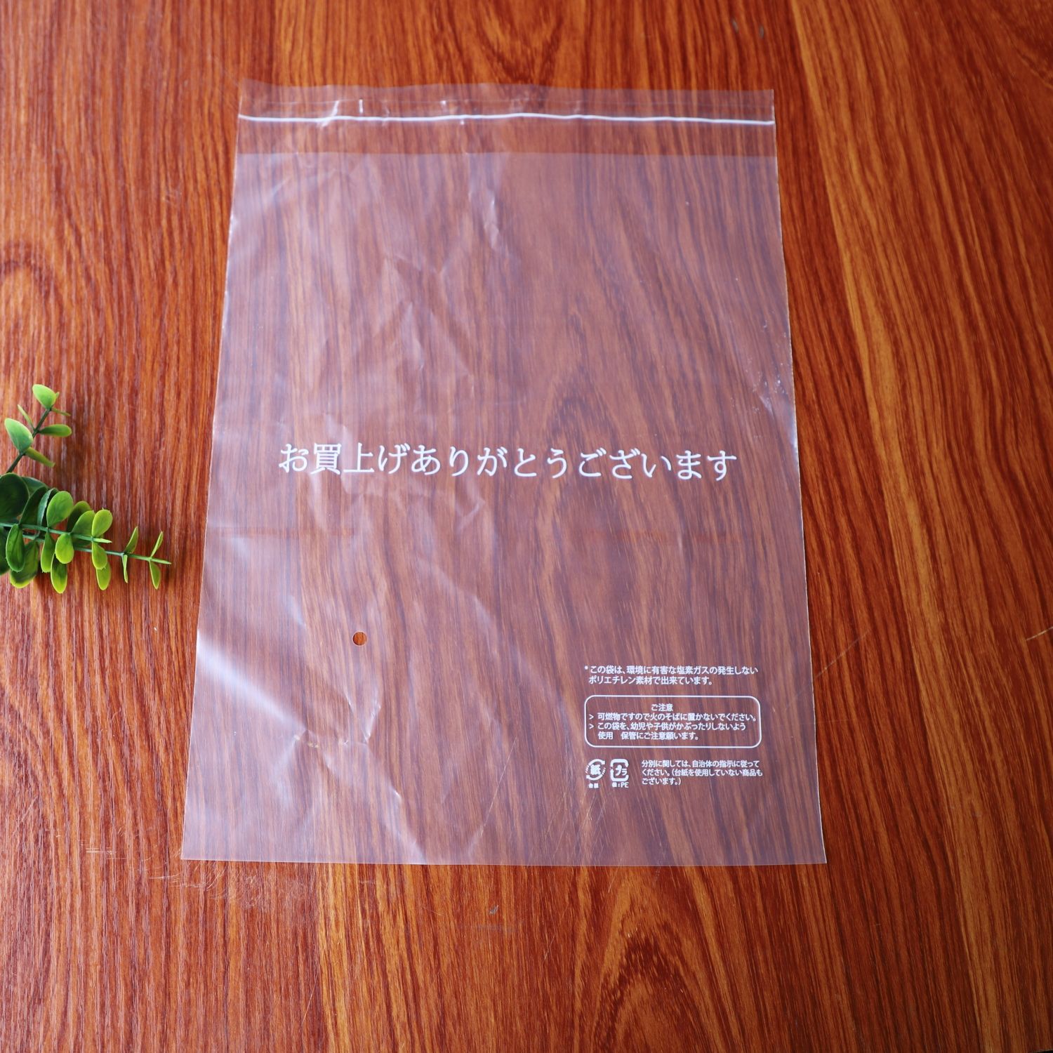 批发白色日文警告语透明PE不干胶自粘袋|深色衣服外贸出口塑料袋