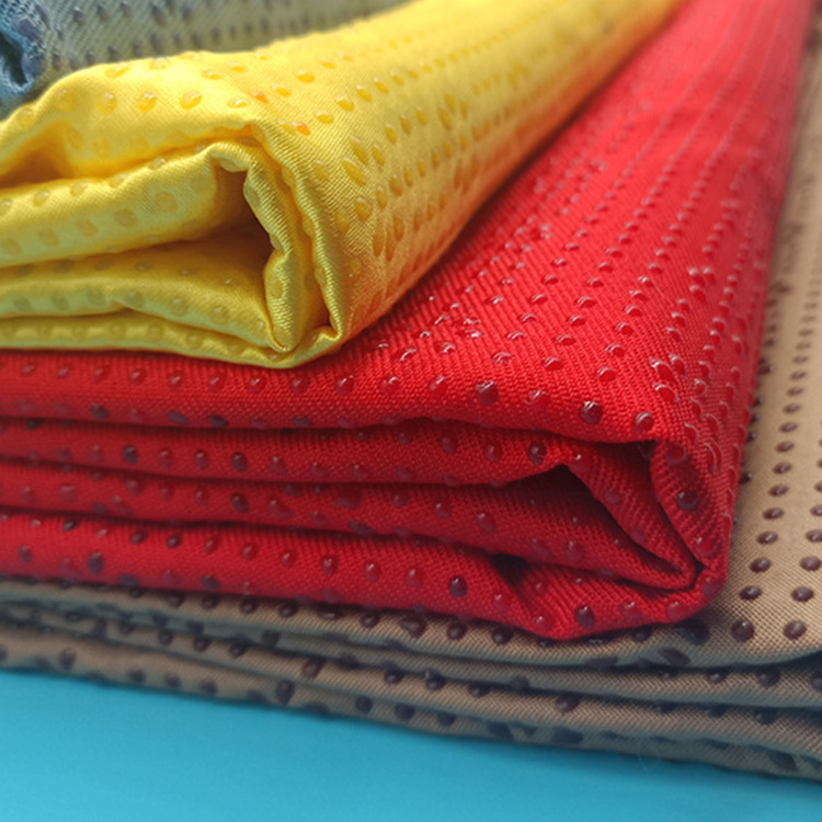 现货供应制服呢梅花点滴塑面料 涤纶防滑斜纹布 箱包沙发布料