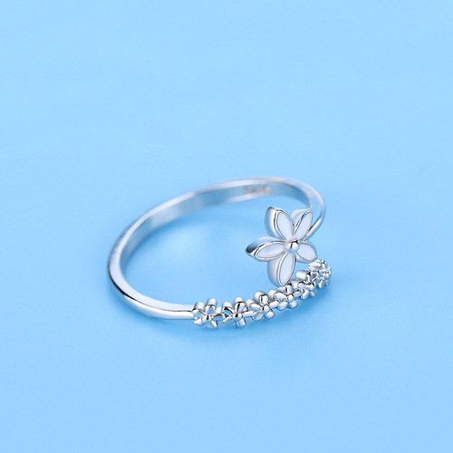 Small fresh and fashionable flower ring forest drip glaze white small flower index finger ring open female Korean version student silver jewelry
