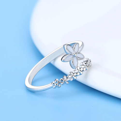 Small fresh and fashionable flower ring forest drip glaze white small flower index finger ring open female Korean version student silver jewelry
