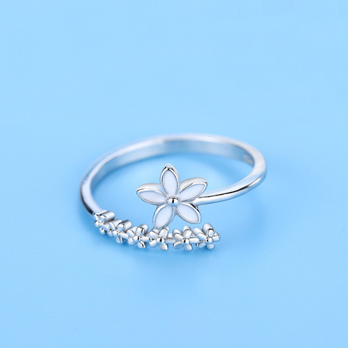 Small fresh and fashionable flower ring forest drip glaze white small flower index finger ring open female Korean version student silver jewelry