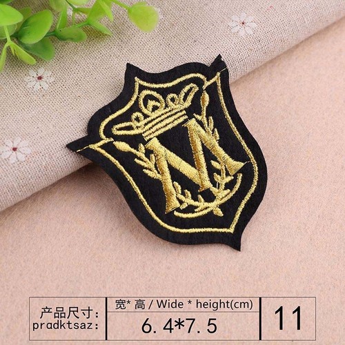 Embroidered patch with a small black logo, trendy for clothes and fashion accessories.