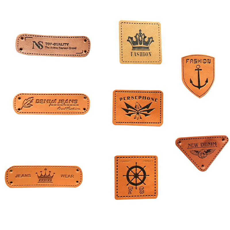 Los fabricantes suministran ropa para hombres y mujeres en stock Logotipo de cuero de PU Logotipo de cuero que hace accesorios de ropa sombrero etiqueta pequeña