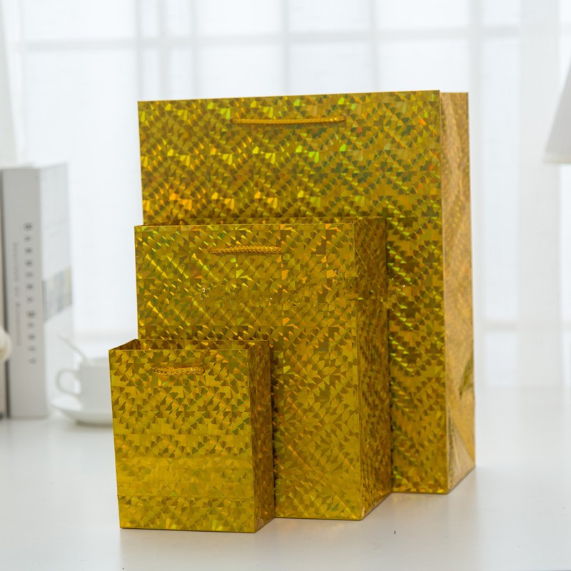 义乌厂家猫眼镭射闪光时尚铜版纸礼品袋 购物服装手提袋纸袋外贸