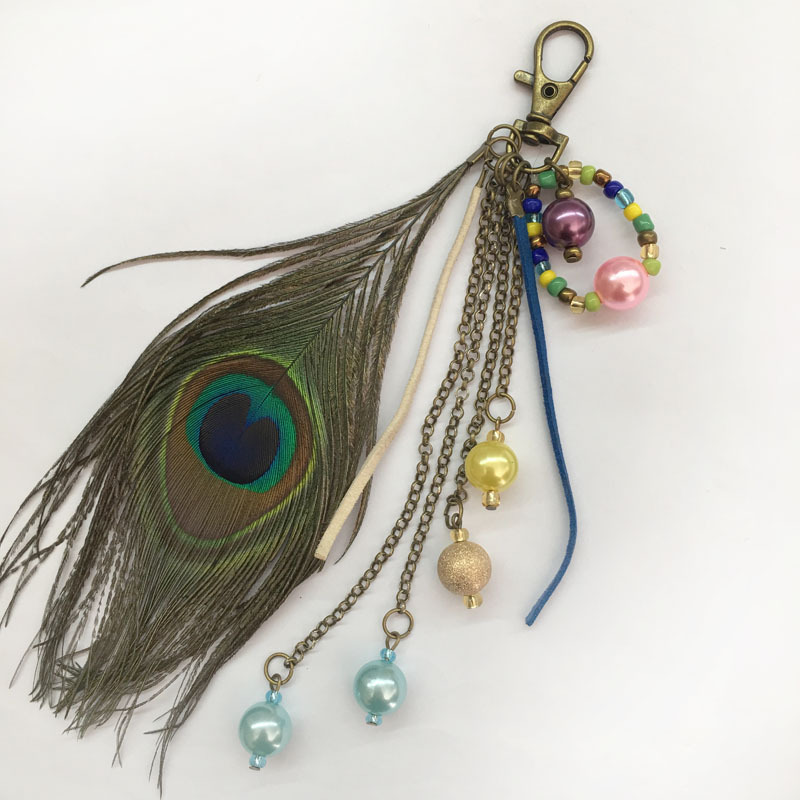 European and American fashion creative peacock feather key chain tassel beads bag key chain pendant Factory Direct European and American fashion creative peacock feather key chain tassel beads bag key chain pendant Factory Direct
