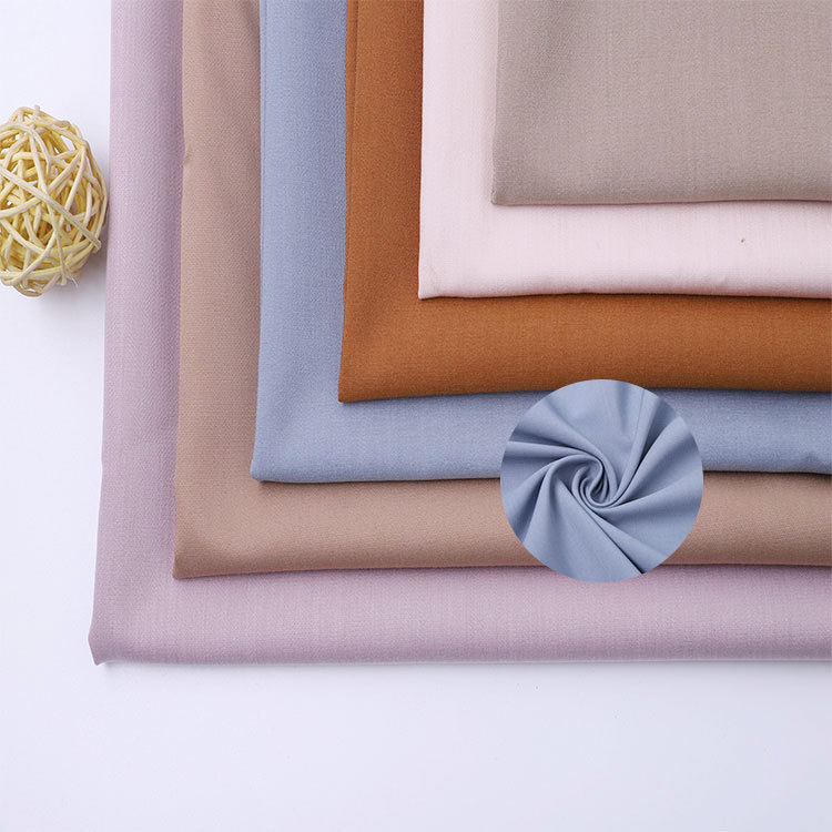 现货连衣裙休闲裤平纹双层tr面料纬弹高密包芯纱服装风衣布料经典