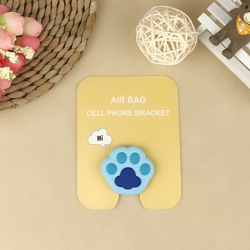 En stock al por mayor TikTok Cartoon creativo soporte de teléfono móvil puede soportar airbag soporte de teléfono móvil soporte de escritorio