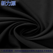 现货供应全涤梭织帆布面料 柔美呢化纤斜纹黑制服工装箱包布
