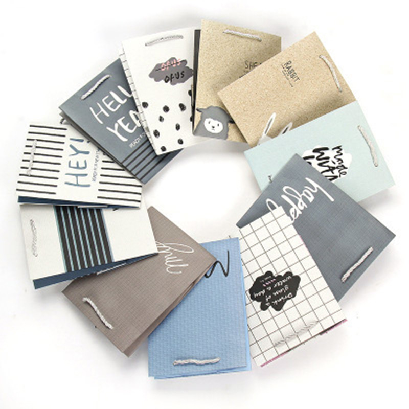 厂家直销现货批发 创意卡通礼品手提袋购物服装袋白卡纸通用纸袋