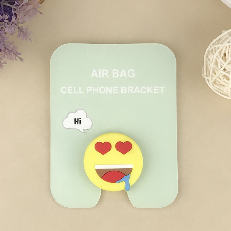 En stock al por mayor TikTok Cartoon creativo soporte de teléfono móvil puede soportar airbag soporte de teléfono móvil soporte de escritorio