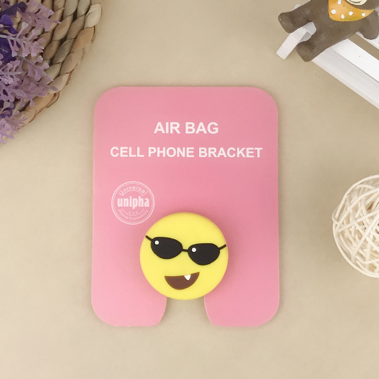 En stock al por mayor TikTok Cartoon creativo soporte de teléfono móvil puede soportar airbag soporte de teléfono móvil soporte de escritorio