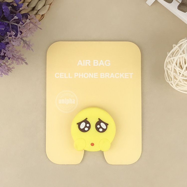 En stock al por mayor TikTok Cartoon creativo soporte de teléfono móvil puede soportar airbag soporte de teléfono móvil soporte de escritorio