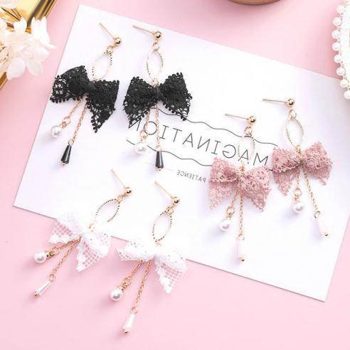 Cute fashionable elegant earrings with bow with tassels pearl…