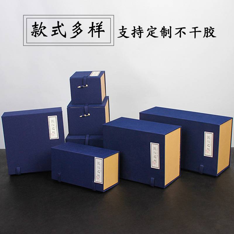A blue fabric-covered, meticulously crafted gift set of Jianzhan (a type of Chinese ware) teacups, purple clay teapots, and ceramic teaware.