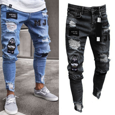 Moda transfronteriza europea y americana rasgada insignia juvenil estiramiento pantalones ajustados pantalones vaqueros de hip hop de los hombres pantalones de moda