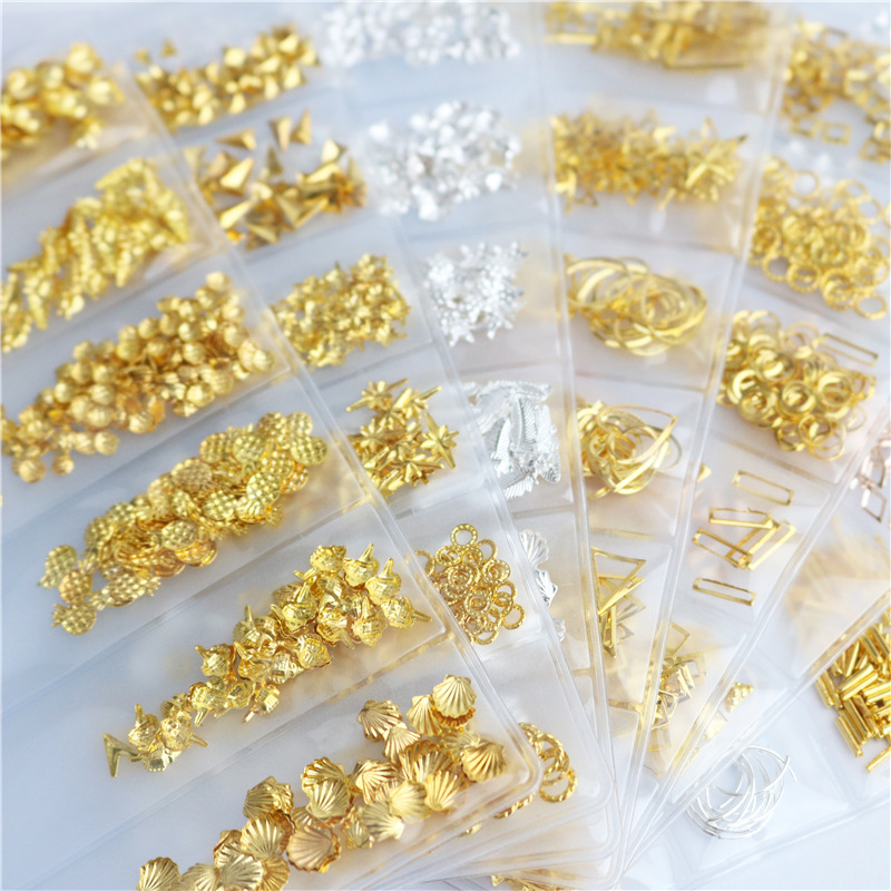 Suministros transfronterizos accesorios de uñas japoneses 6-rejilla bolsa remache joyería parche de metal decoraciones de taladro de uñas