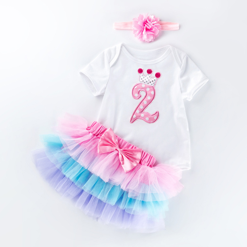 Venta directa de fábrica: Conjunto de vestido para el primer cumpleaños de bebé niña, pelele de manga corta, falda de seis capas, accesorio para el cabello, conjunto de fiesta de 3 piezas.