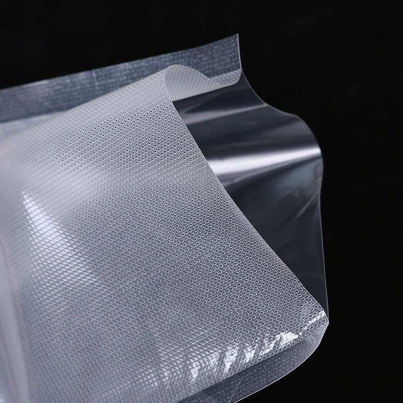 真空バッグは、模様入りの透明プラスチックで、厚手の食品包装袋、鮮度保持袋、包装袋、模様入り真空バッグです。