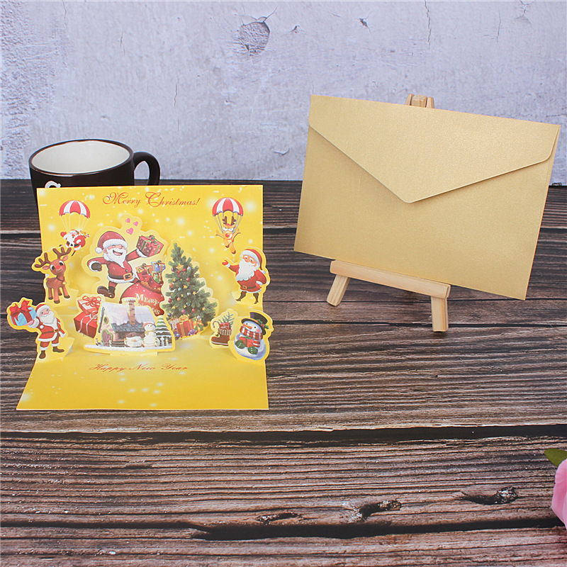 En stock creativo 3D dorado Navidad tridimensional tarjeta de felicitación de dibujos animados Santa Claus muñeco de nieve bendición mensaje tarjeta pequeña