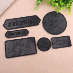 Embroidered leather patches for clothing and pants, computerized embroidery with skull badges and decorative patches, adhesive backing for patch decoration.