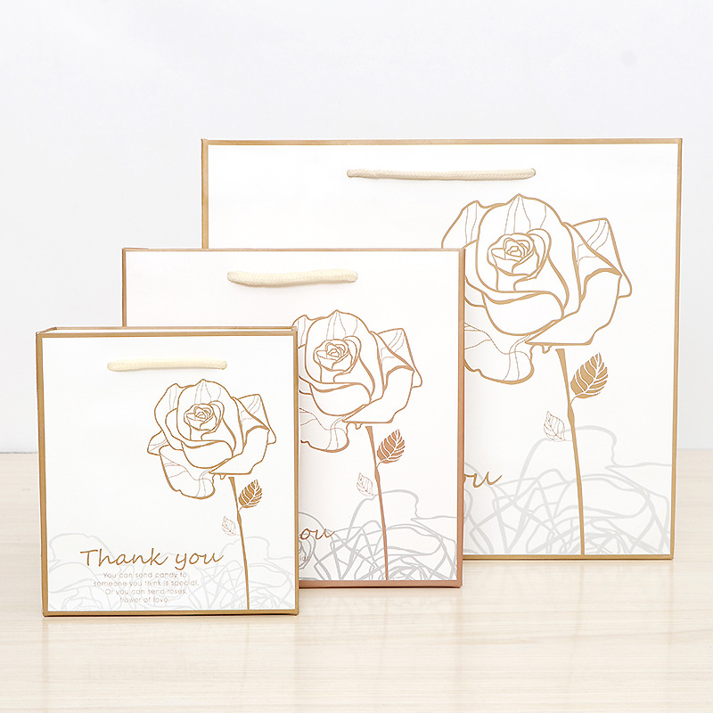 金花白底金边烫金印刷黑白卡牛皮纸袋  礼品服装包装袋 彩印logo