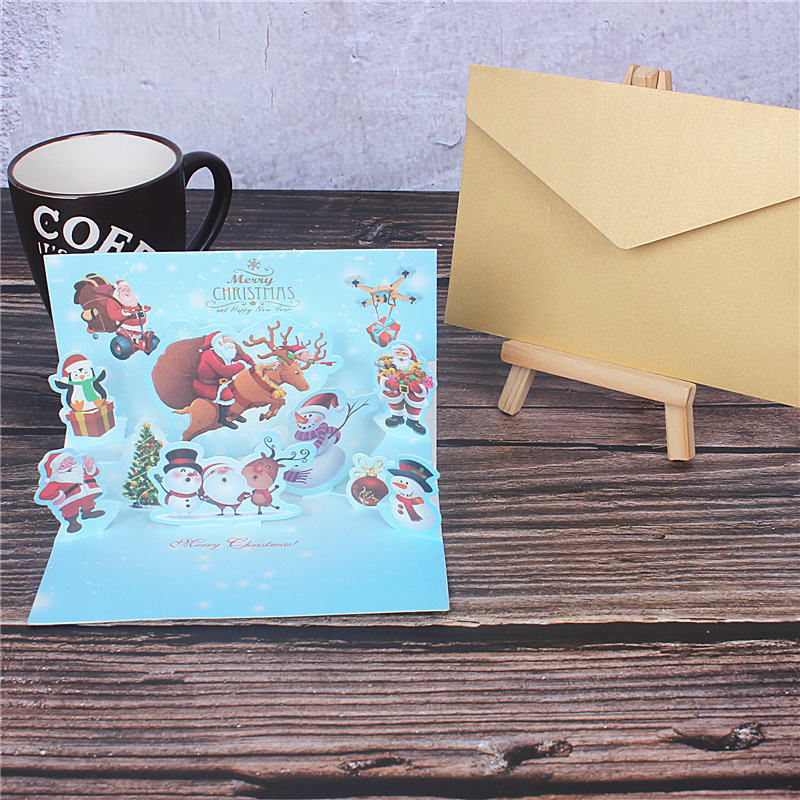 En stock creativo 3D dorado Navidad tridimensional tarjeta de felicitación de dibujos animados Santa Claus muñeco de nieve bendición mensaje tarjeta pequeña