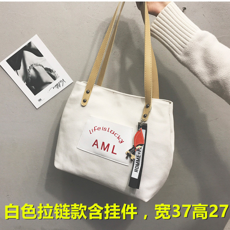 Bolso de cubo de un solo hombro de gran capacidad bolso de mensajero perezoso personalizado nuevo bolso de lona 2024 diseño de nicho femenino