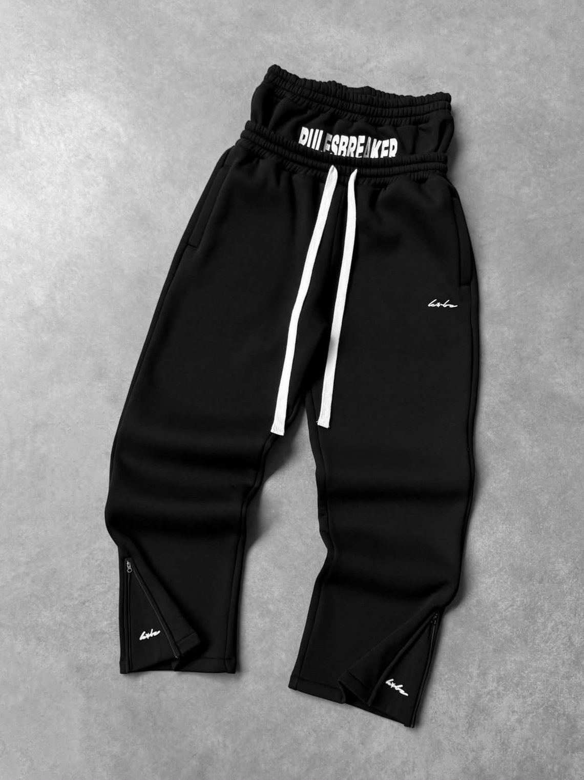 2025 Europa y América Cross-border street hip-hop holgados pantalones casuales rectos pantalones con cremallera pantalones de cintura doble falsos de dos piezas