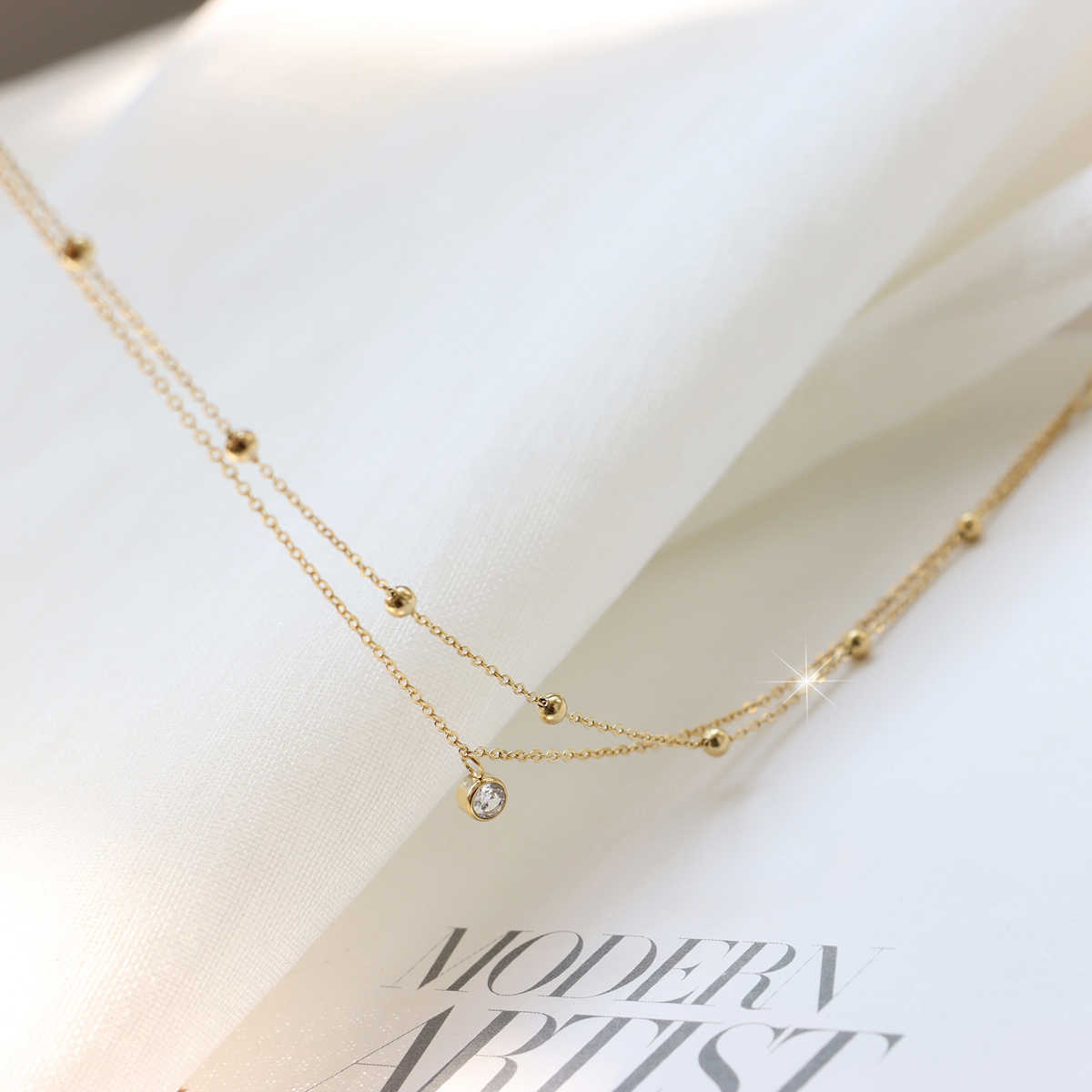 Doble capa de un solo diamante de acero de titanio pulsera femenina sensación exquisita versátil nueva moda ligera lujosa alta sensación flash pulsera de diamante pie accesorios