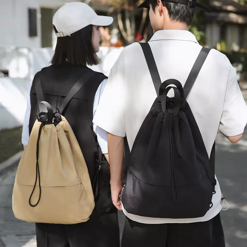 日系新款超轻旅行束口背包潮男女通用双肩包通勤大容量抽绳水桶包