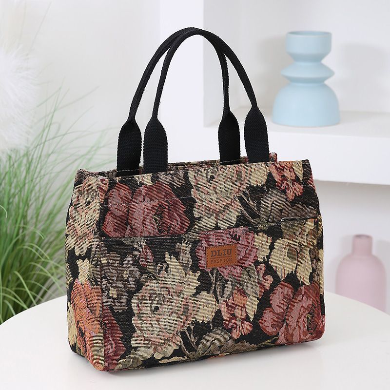 This retro handbag features a tote flower oil painting style. It's convenient to carry a lunch box to work. It has a large capacity and is a mommy bag for going out undefined