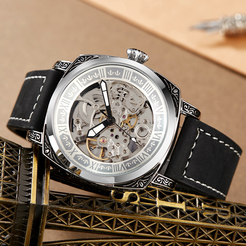 Nuevo reloj transfronterizo en vivo de los hombres de cuero genuino estilo nacional diseño hueco en relieve tallado impermeable luminoso reloj mecánico hombres
