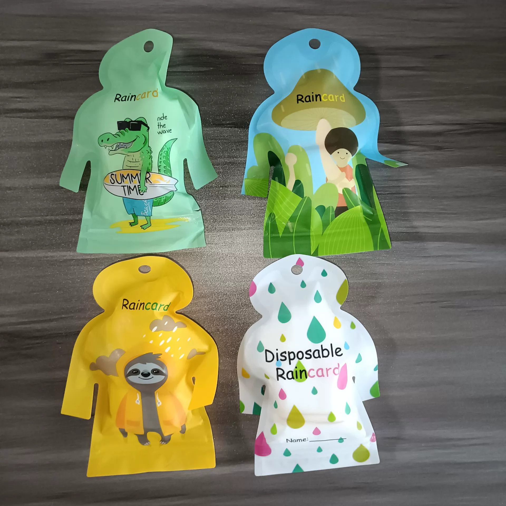 Цельный минимальный портативный бестселлер, изысканная упаковка, дорожный плащ, одноразовый мультяшный небольшой упаковка, пластиковое пончо