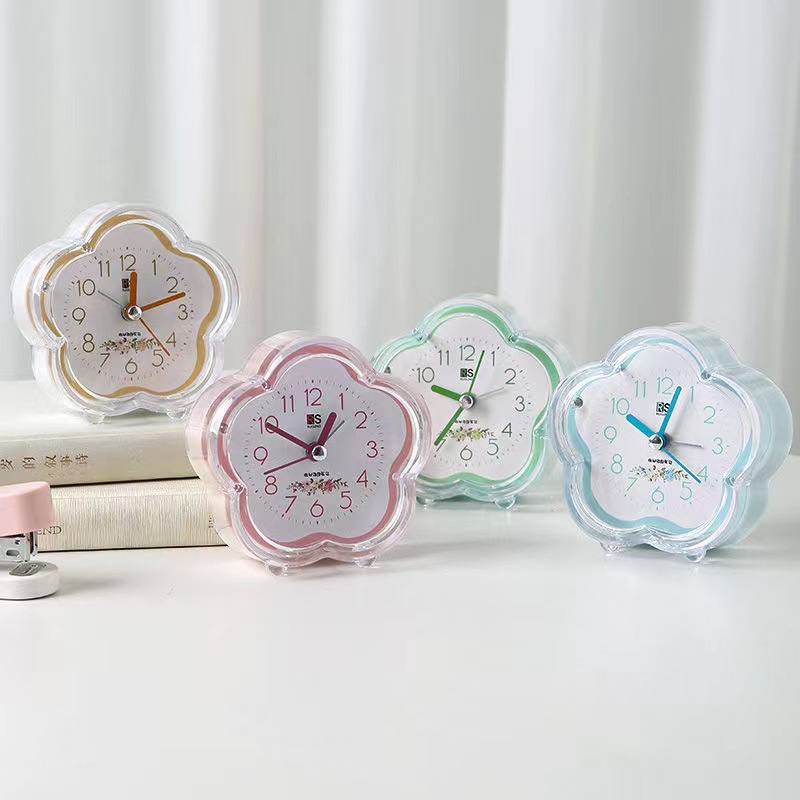 Ventas de fábrica simple reloj de alarma de plástico estudiante reloj de color caramelo con luz en forma de flor de dibujos animados fácil de llevar reloj de alarma