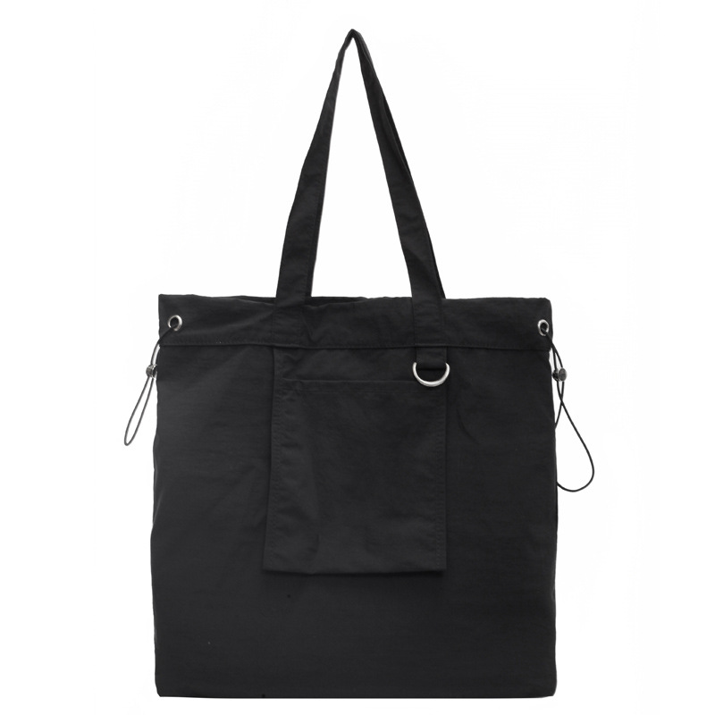 Bolsa de tela de nylon impermeable para mujeres 2025 nuevo tipo bolso de cubo de viaje ligero de gran capacidad bolso de hombro portátil para estudiantes universitarios