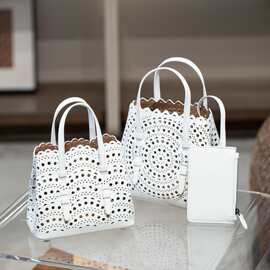 镂空雕花菜篮子包包编织真皮女包单肩斜跨托特包沙滩手提水桶女包