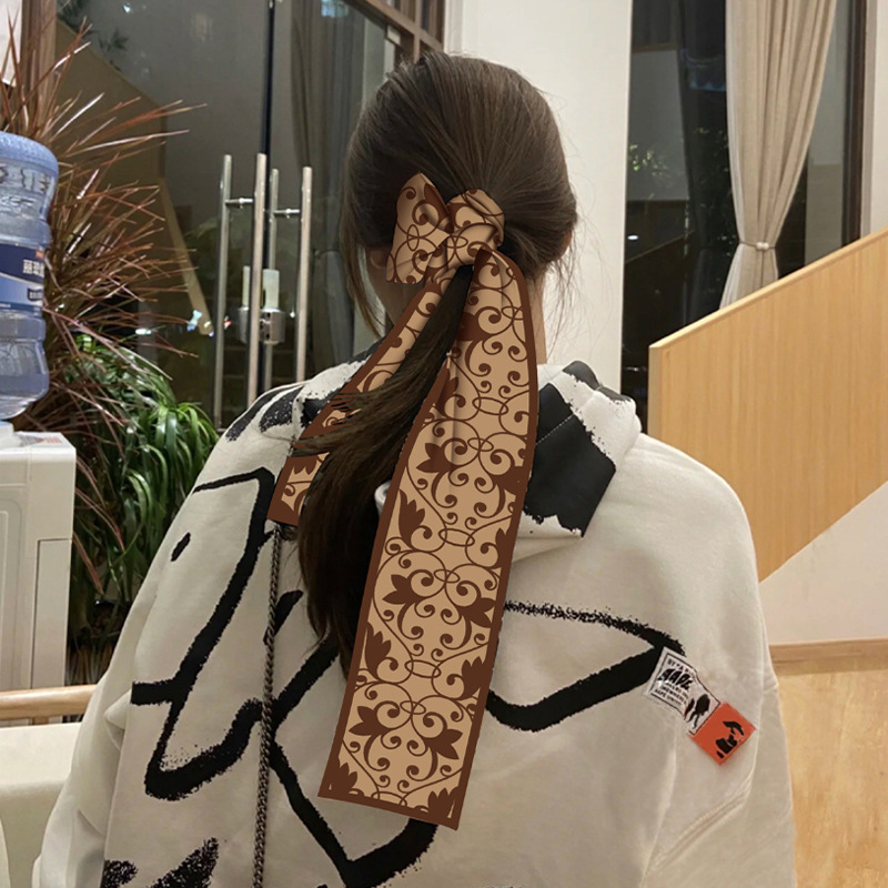 Nueva serie de Dunhuang larga pequeña bufanda de seda estilo coreano de alto grado versátil decorativo profesional pequeña bufanda cinta atada bolsa
