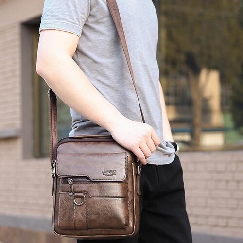 Fashionable unisex backpack with textured finish, trendy men's shoulder bag, stylish briefcase, casual men's crossbody bag, leather goods.