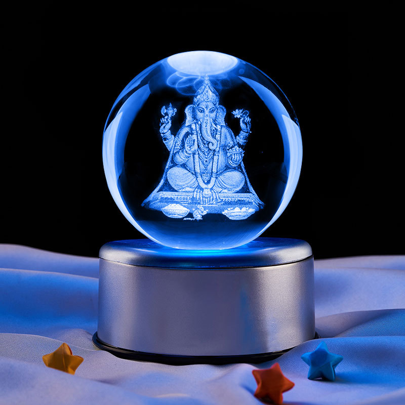 Bola de cristal de 8 cm + luz de siete colores rotación dieciocho base de música